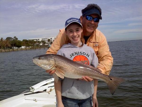 girl with guide and redfish